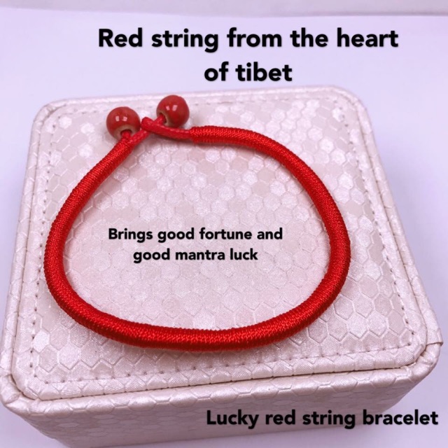 Red rope hot sale bracelet meaning