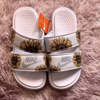 Nike sunflower flip online flops