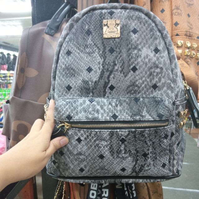 Mcm snakeskin outlet backpack