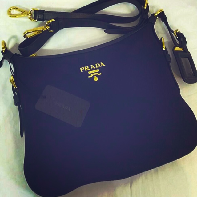 Prada blue sling outlet bag