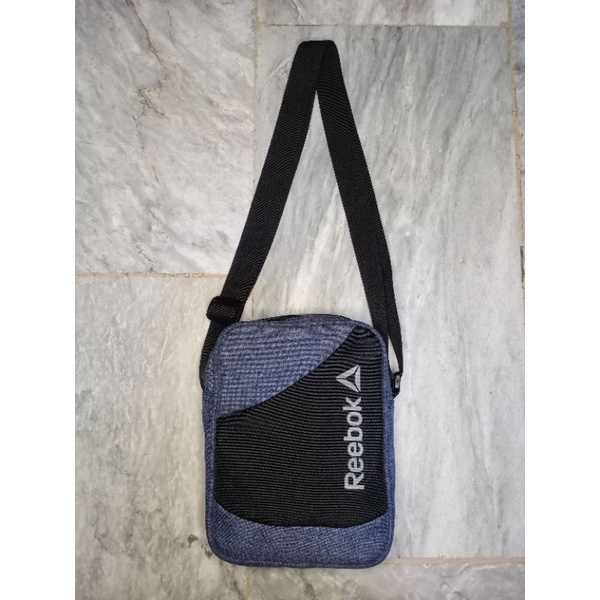 Reebok sling hot sale backpack