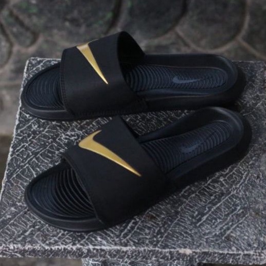 Nike slippers black and gold deals