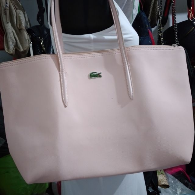 Pink hot sale lacoste bag