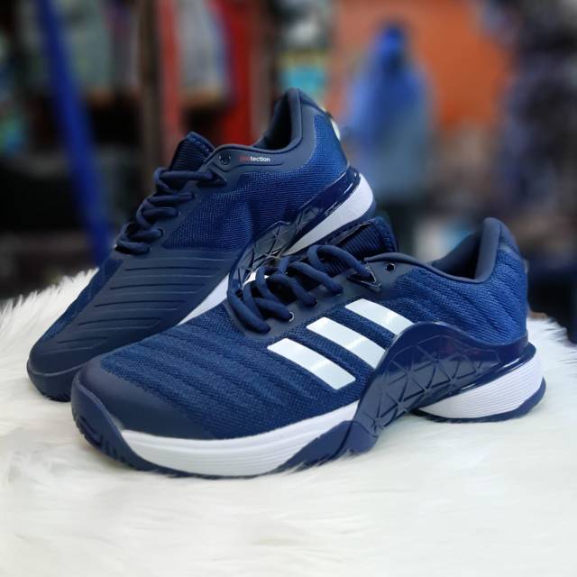 Navy blue on sale adidas tennis shoes