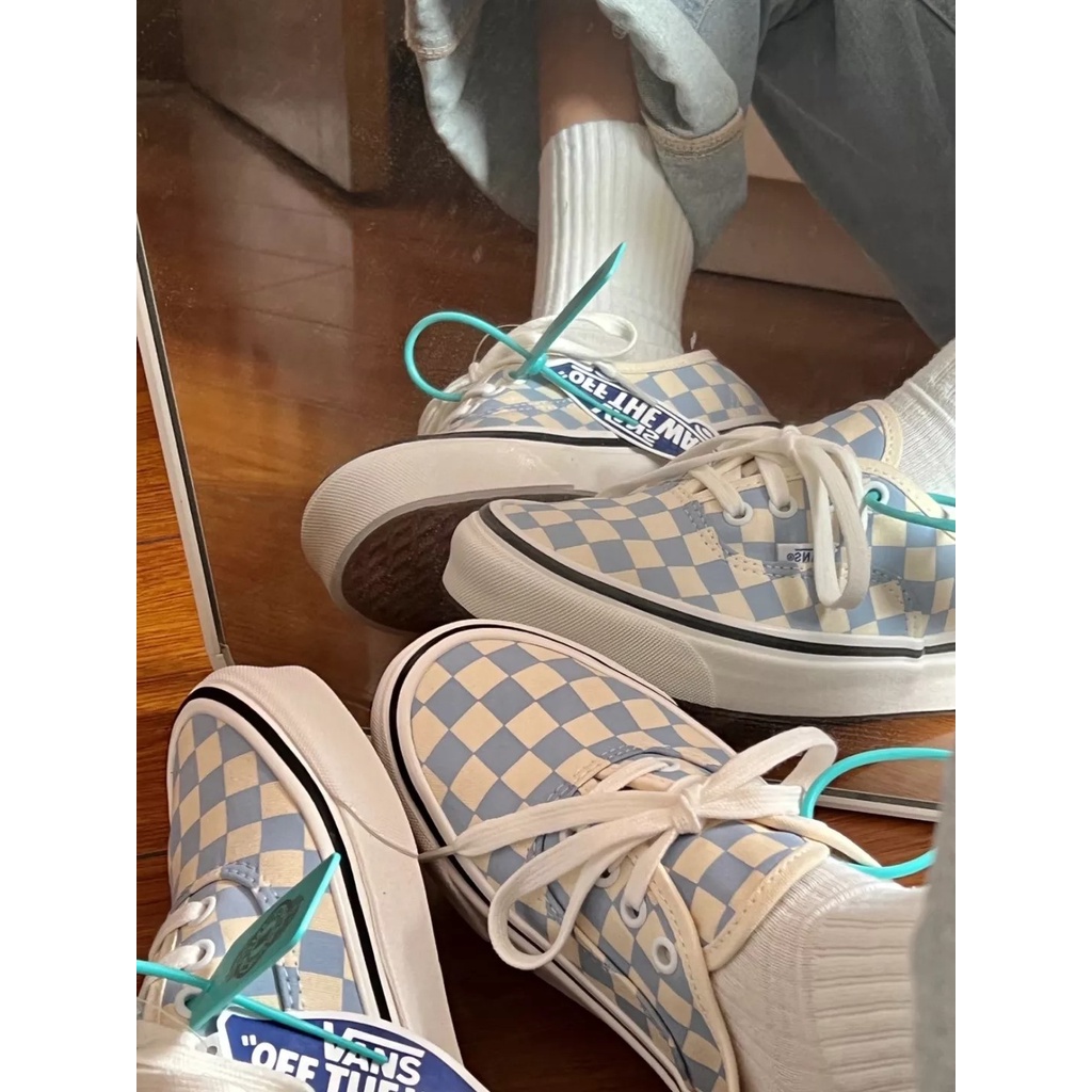 Blue checkerboard clearance vans on feet