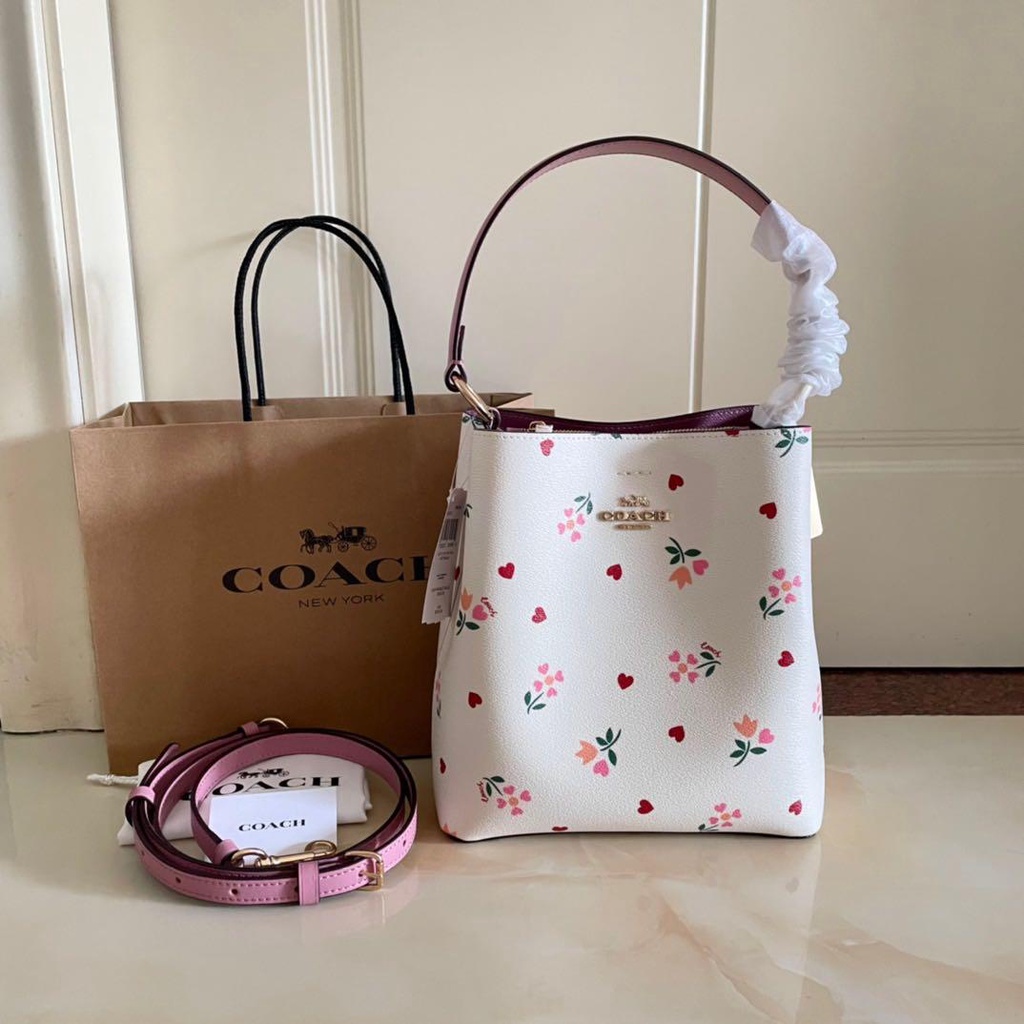 Pink coach bucket discount bag