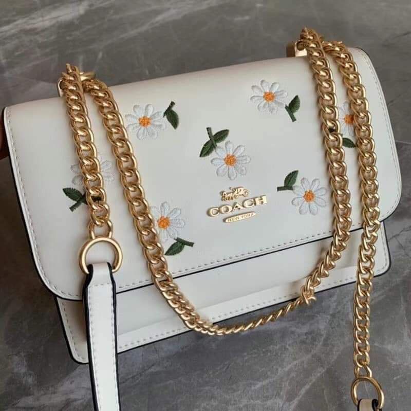 Coach klare crossbody with daisy embroidery