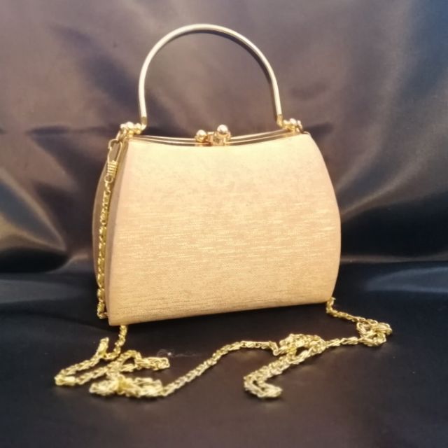 Gold sling sales bag