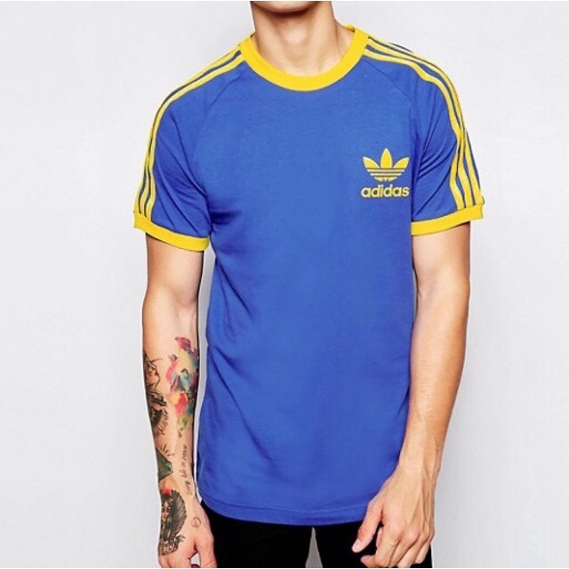 Adidas blue store with yellow stripes