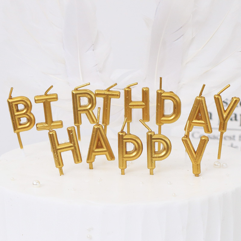 Goldplated letter happy birthday happy birthday candles birthday cake