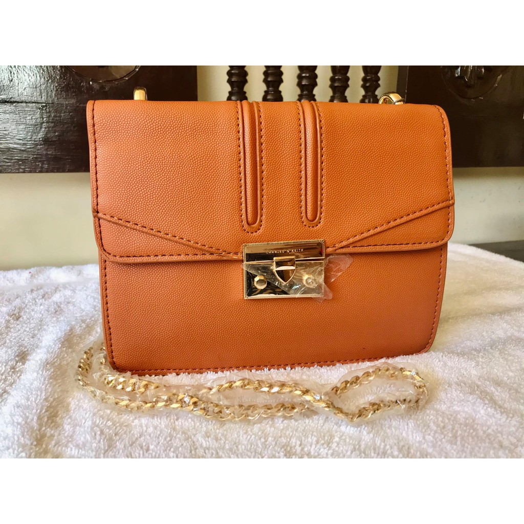 Charles and keith orange sling online bag