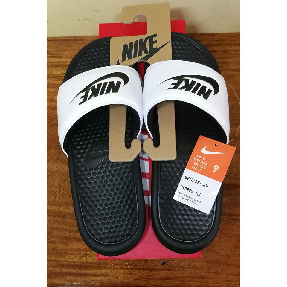 Half black half white best sale nike slides