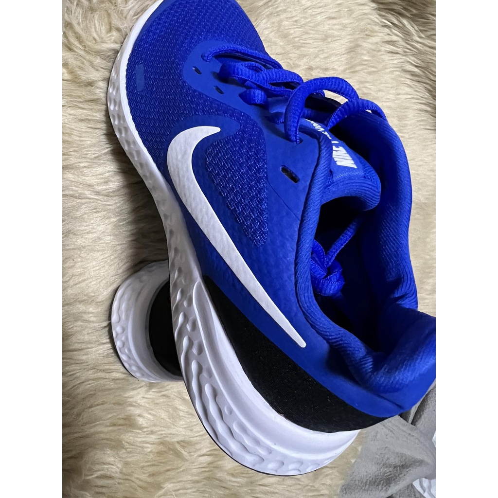 Nike best sale revolution 23.5