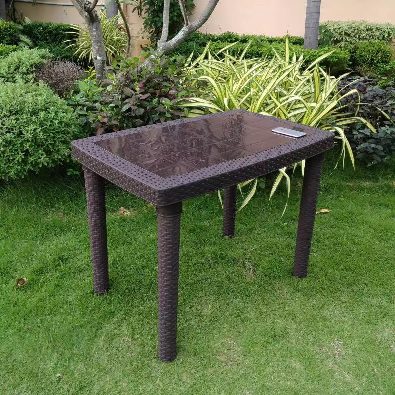 Brown rattan store table only