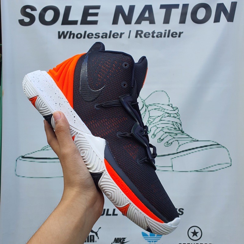 Kyrie black and store orange