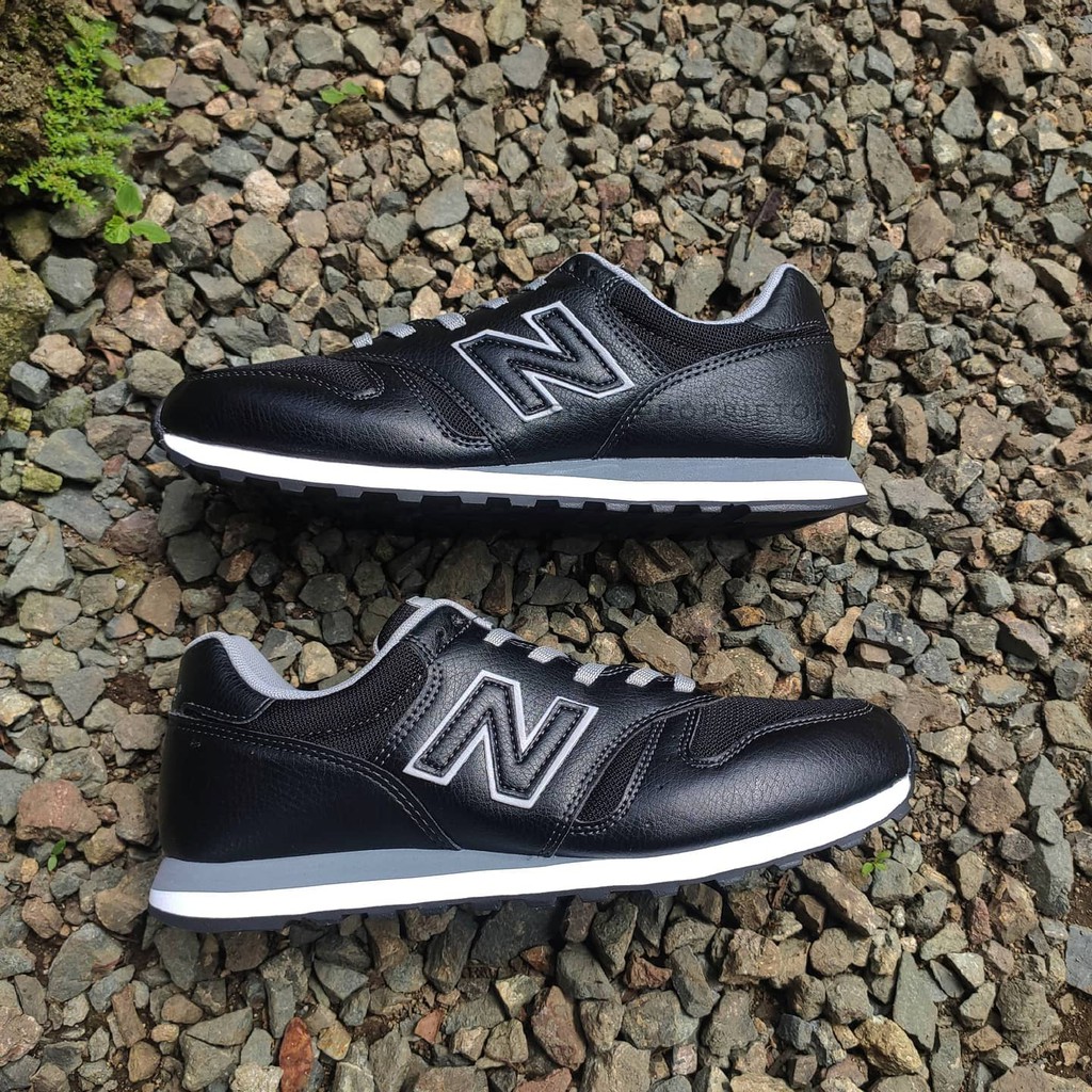 New balance 373 black leather hotsell
