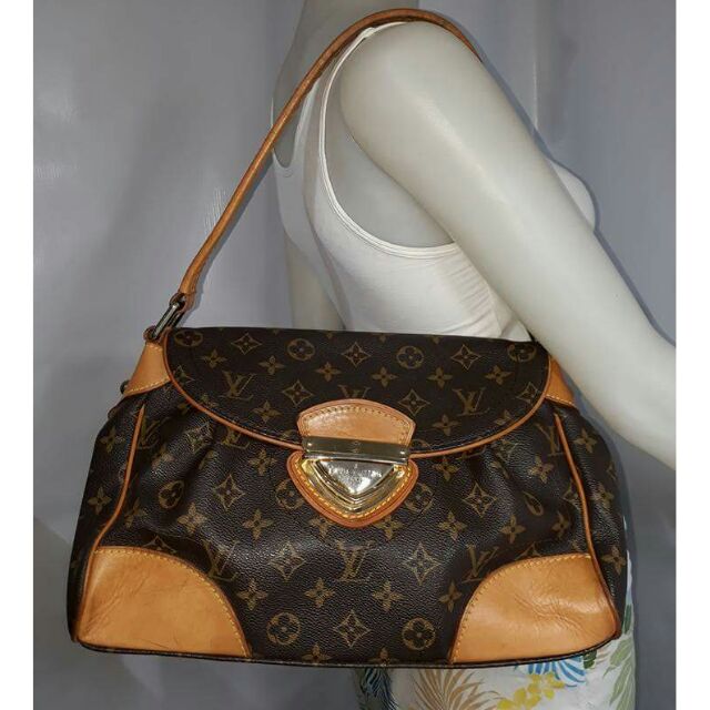 Louis Vuitton Cite Bag Monogram Canvas Brown in Coated Canvas/Leather with  Gold-tone - US