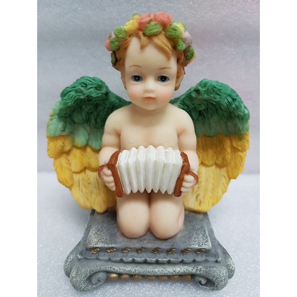 4 inches poly angel sitting with musical instrument | Shopee Philippines