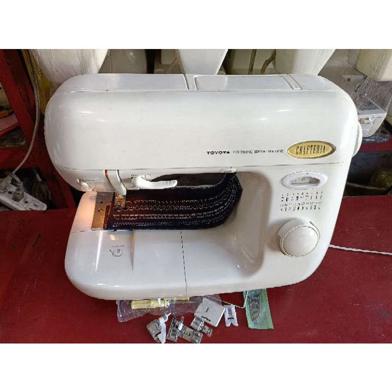 Toyota brand sewing machine heavy duty pushbutton operate.16 multiple