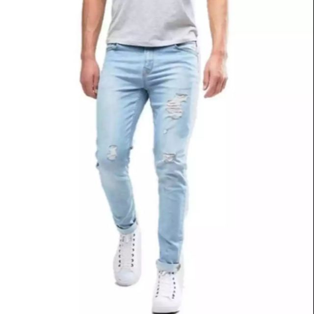 Tattered store blue jeans