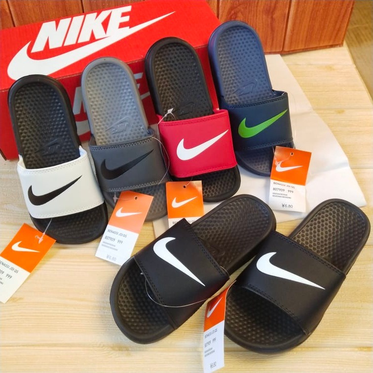 Nike benassi slides junior online