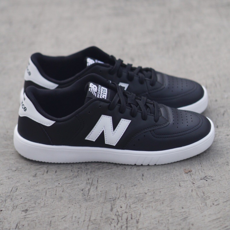 New balance black hot sale and white shoes