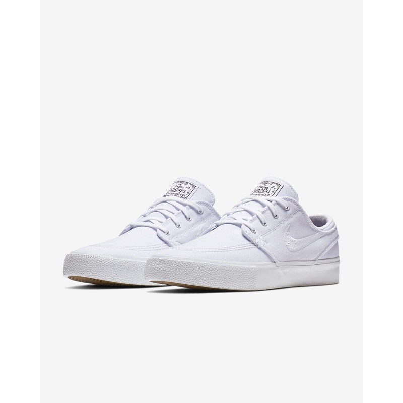 Nike janoski store triple white