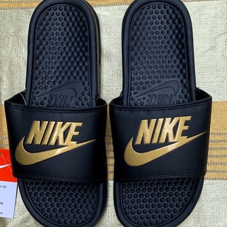 Nike slippers best sale with gold check