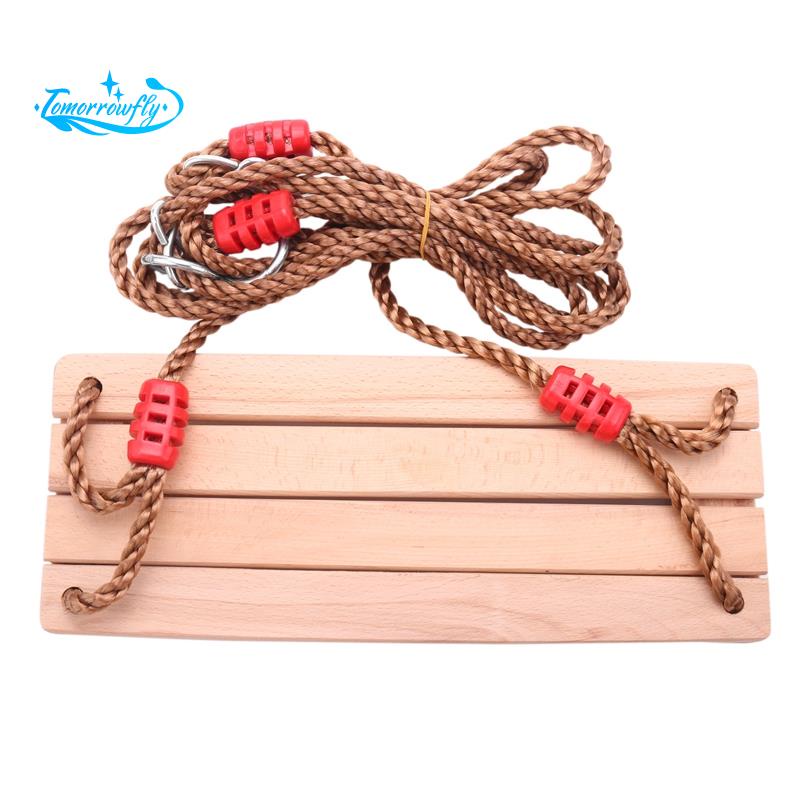Adults and children swinging swings swinging wooden swing with rope