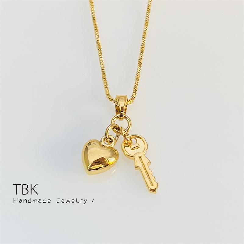 Gold heart and key necklace hot sale
