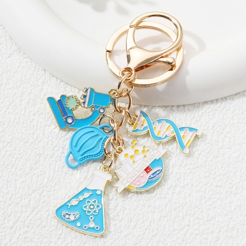 Cartoon Measuring Cup Microscope Molecule Enamel Keychain Scientific ...