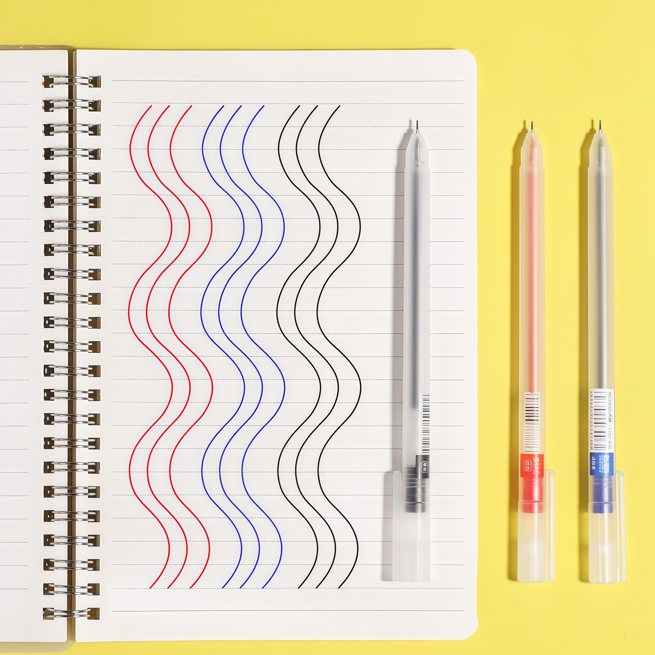 Gel pen set for writing: blue, black, red.