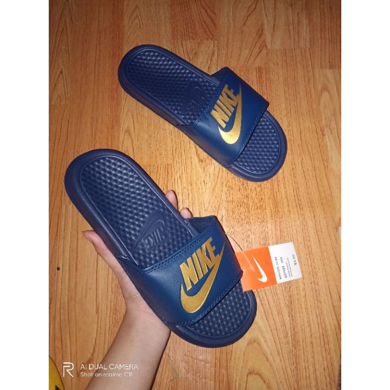 Blue and gold hot sale nike flip flops