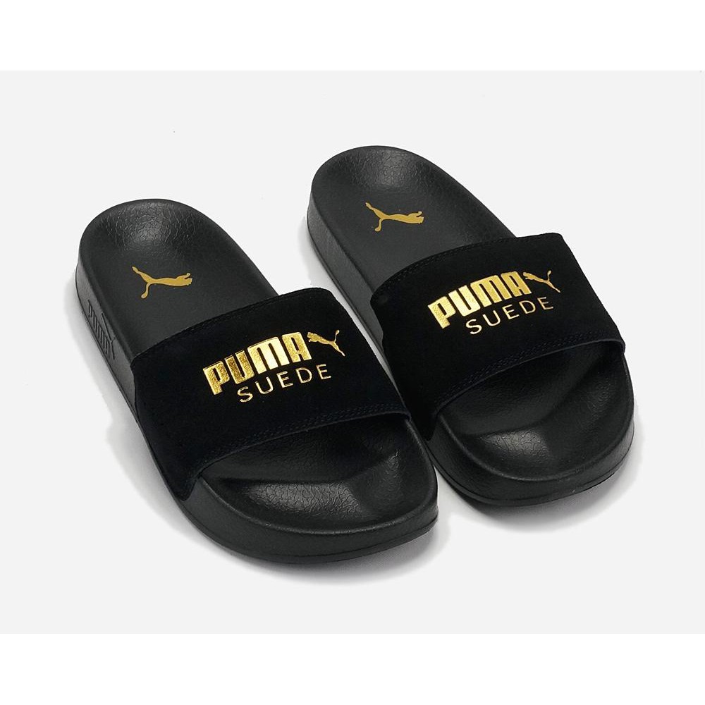 Puma slides best sale black and gold