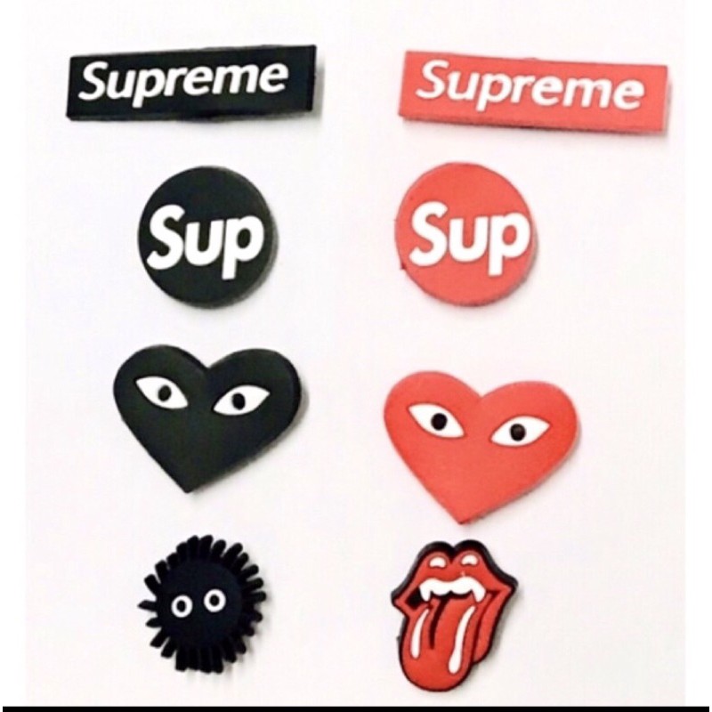 Supreme store crocs charms