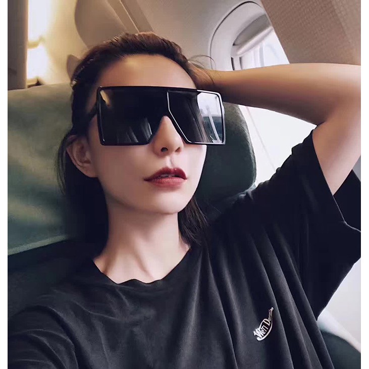 Girl with 2024 big sunglasses