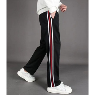 Black track pants with red outlet stripe