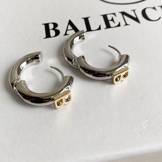 Balenciaga store pig earrings