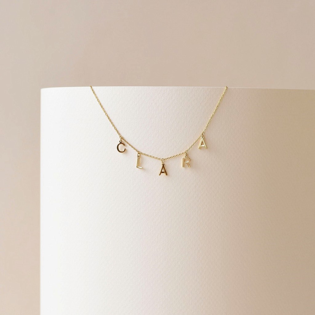 Necklace with dangling on sale letters