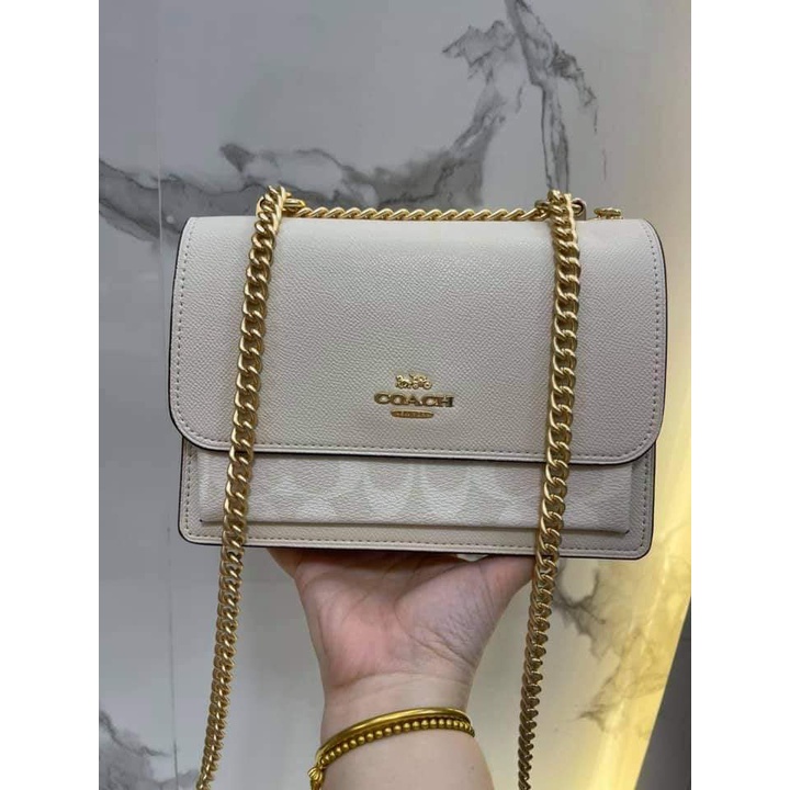 Gold chain store sling bag