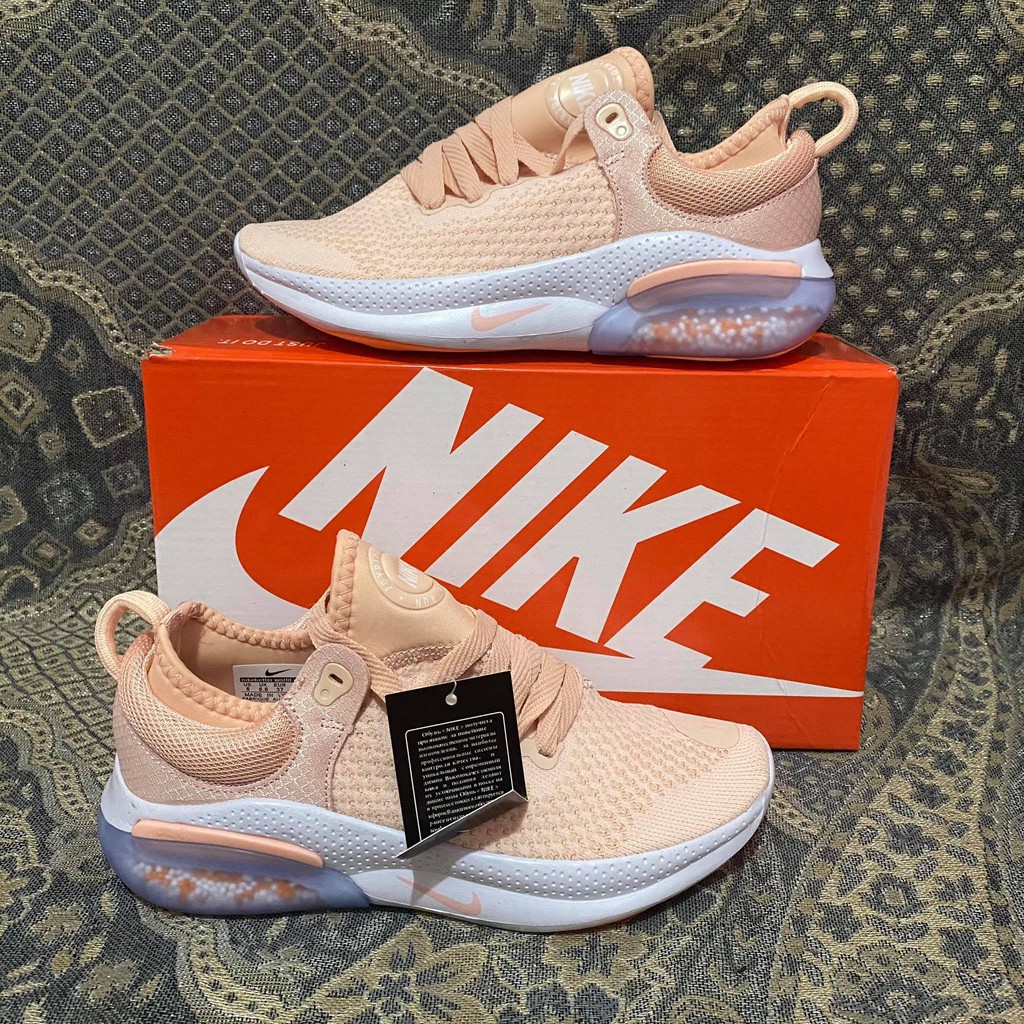 Peach colored top nike shoes