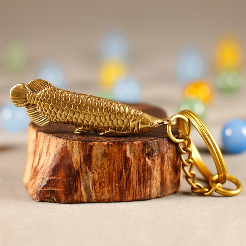 Silver dragon fish keychain made of brass symbolizing luck, feng shui ...
