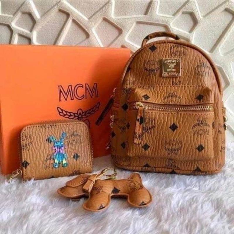 Mcm triple bag discount backpack