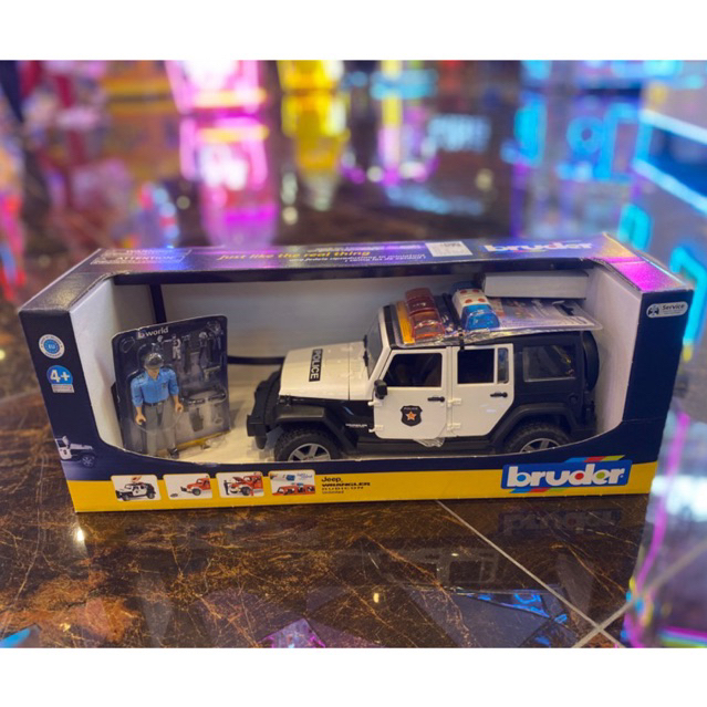 Bruder Jeep Wrangler Unlimited Rubicon Policía – Vehículo 1:16 Con Luces Y Sonido, Agente Incluido, Puertas Y Capó Abatibles