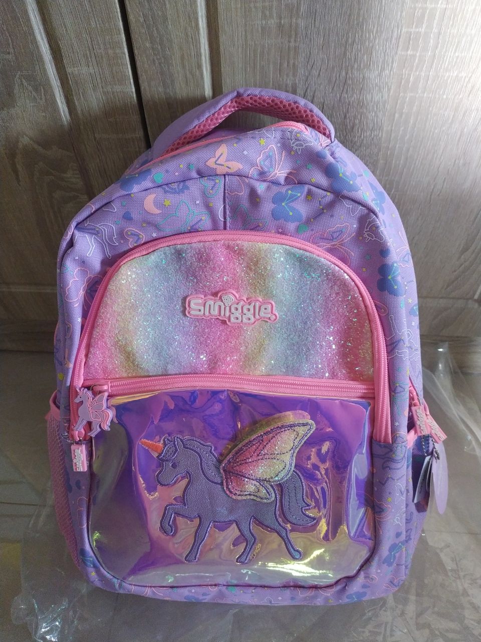 Smiggle - Our best selling Sky backpack features glitter panels and 3D  unicorn wings 🦄 perfect for school or sleepovers!