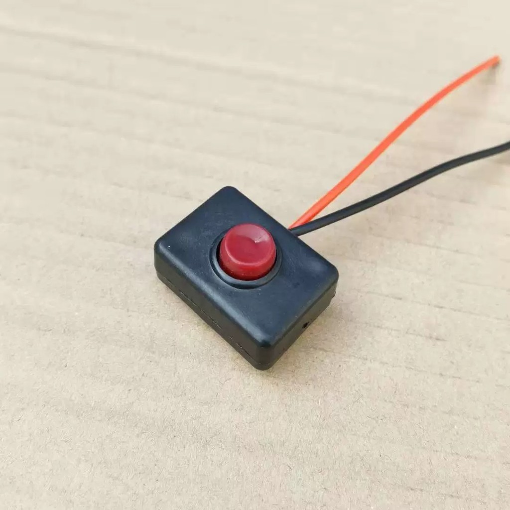 A small red button switch, horn switch, modified switch, car light ...