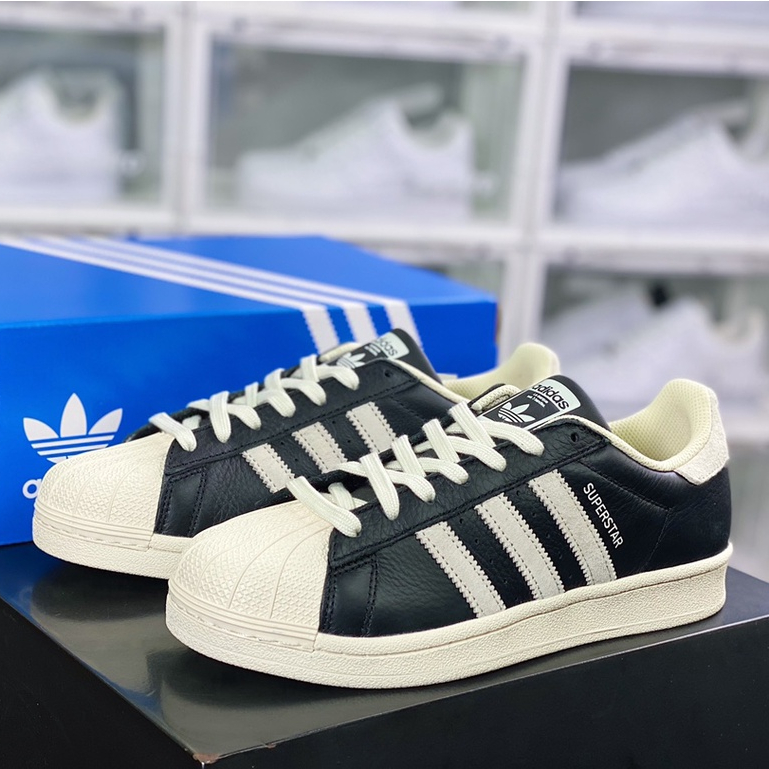 Superstar black outlet with blue stripes