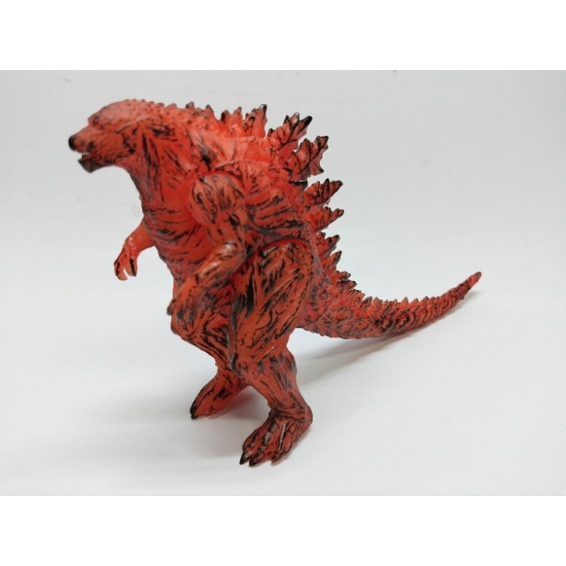 Godzilla toy with cheap blue fire