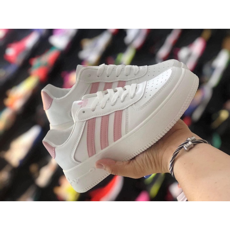 Adidas white best sale with pink stripes