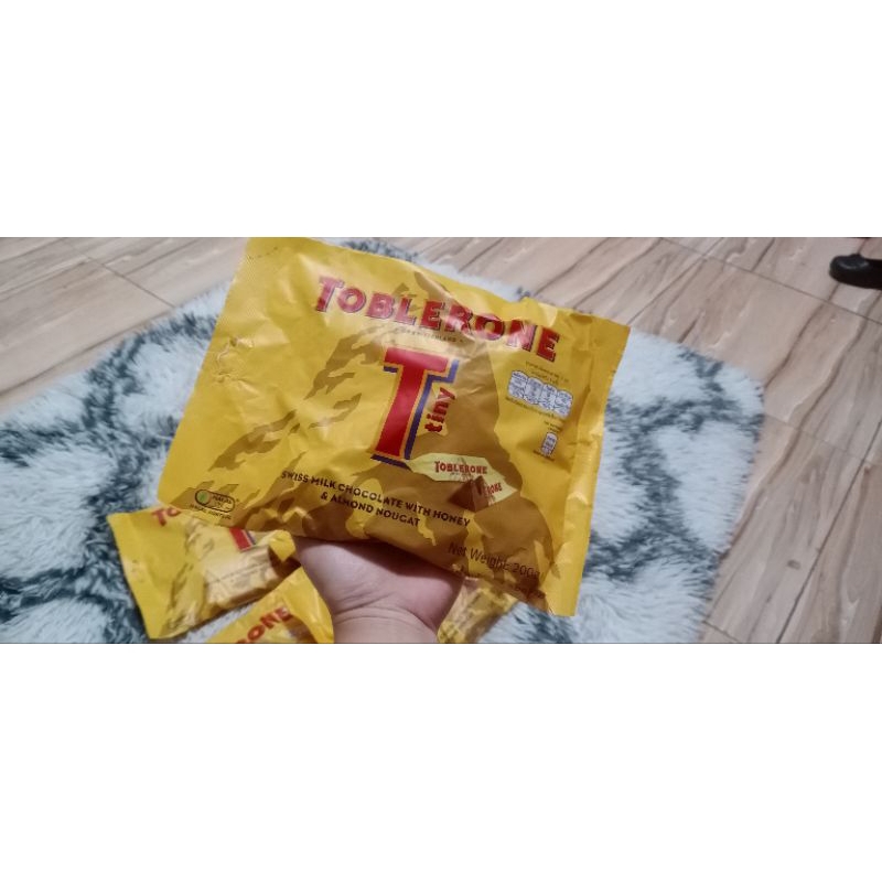 Toblerone Tiny Swiss Milk Chocolate Candy Bars with Honey and Almond  Nougat, 7.05 oz Bag 